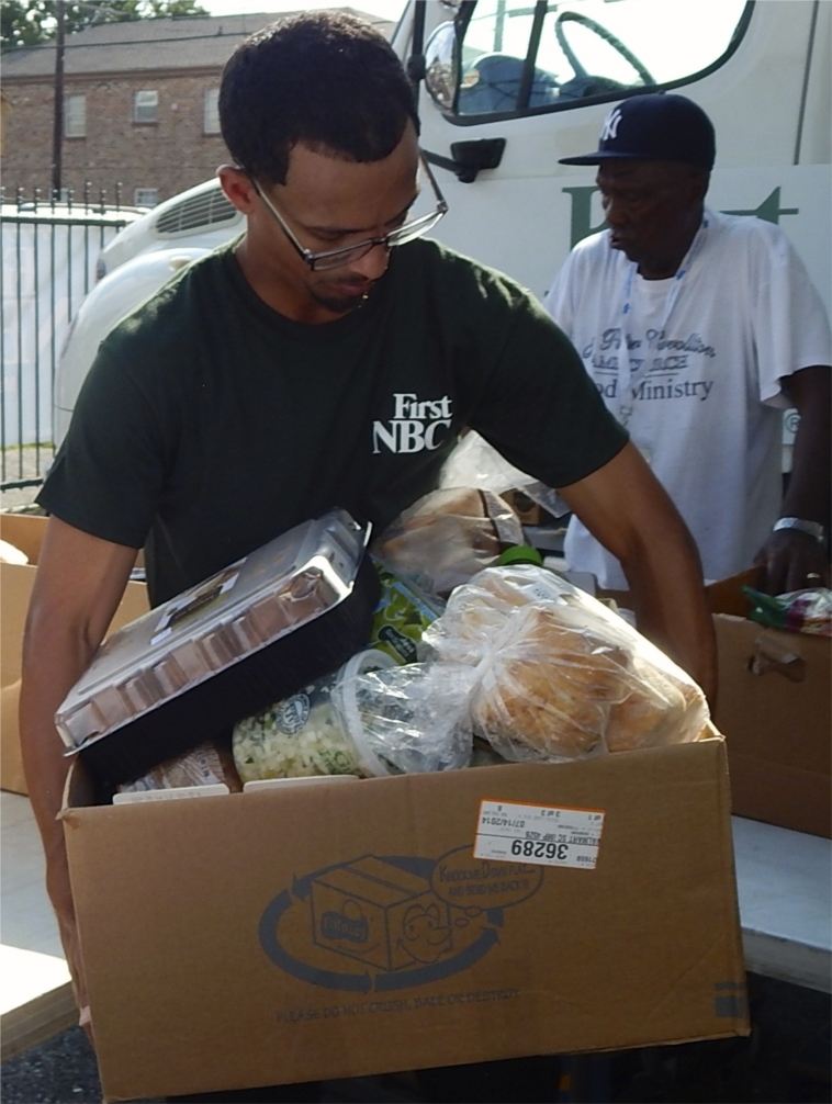 An employee volunteering with Second Harvest Food Bank