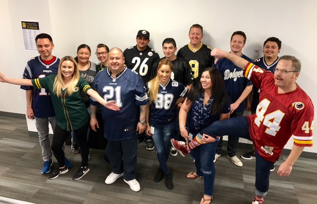 Team Motive Lending celebrating their favorite teams in honor of Super Bowl Sunday.
