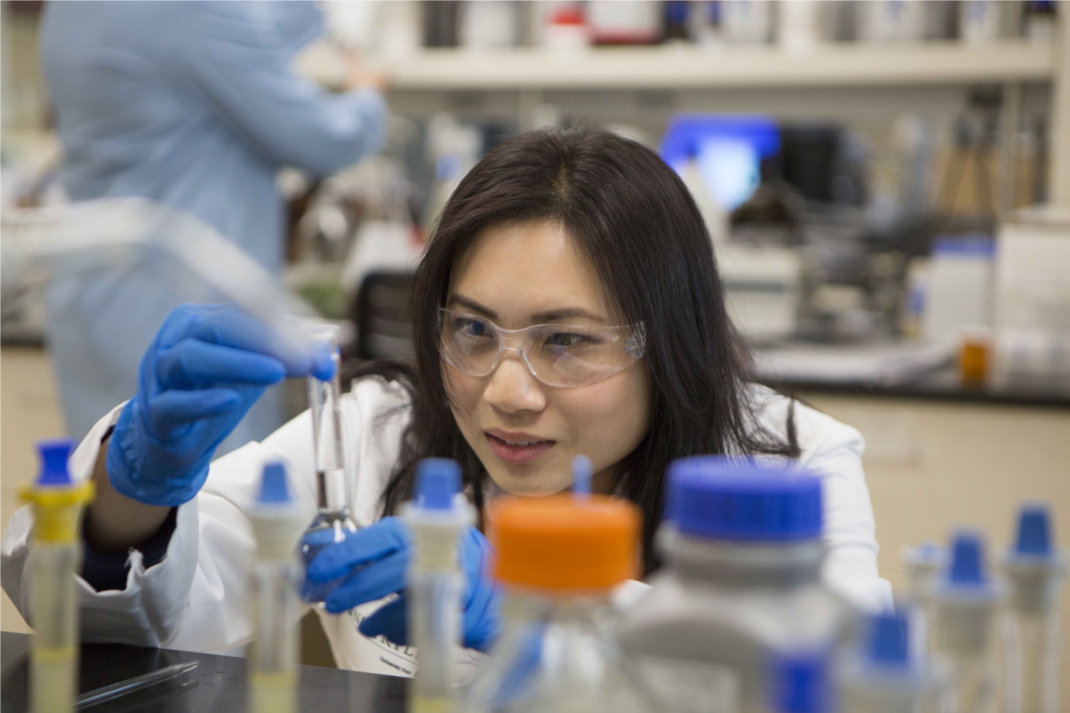 Desirae Lau, a manager in Quality Assurance, demonstrates of the many quality tests performed in Nutrilite's ISO certified labs. Our experts perform more than 25,000 tests each month and more than 500,000 quality evaluations each year.