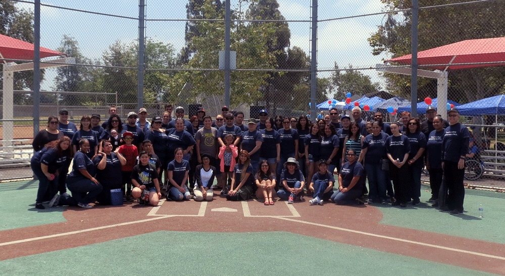 CU SoCal team members volunteer at the closing ceremony for the Orange County Miracle League, a baseball league for children and adults with special needs.