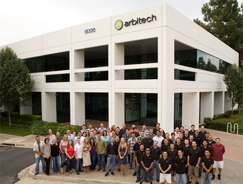 Arbitech employees in front of our headquarters