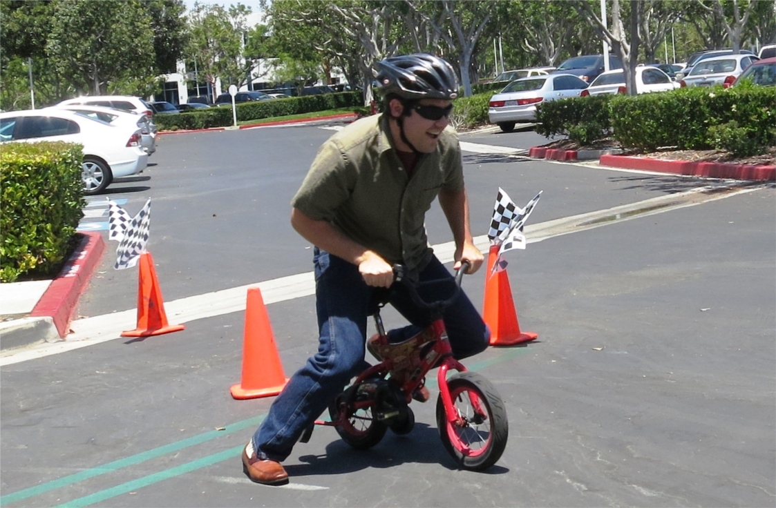 Stantec Orange County team member Eric Walker participates in the firm's miniature bike races and summer barbecue outside their Irvine office.