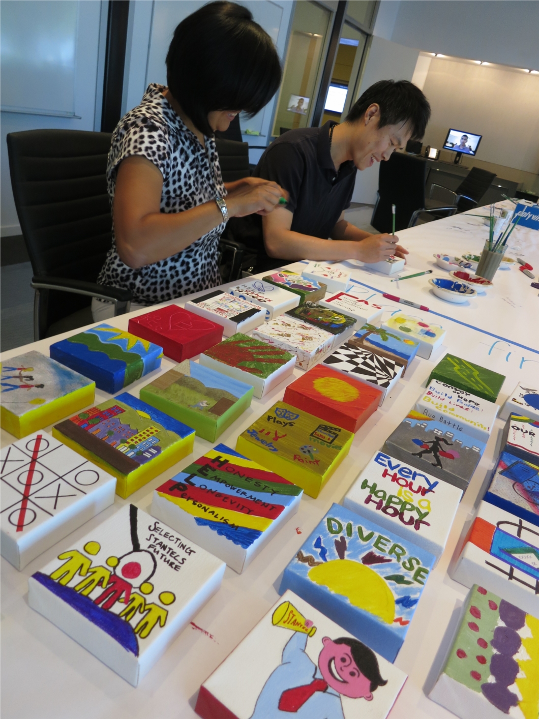 Each of the company’s Orange County employees painted “what inspires them in their careers” on a 5”X5” canvas during a June office dedication and 30th anniversary staff celebration. The finished canvases are displayed permanently in the “Employees’ Gallery” in the firm's Irvine office. 