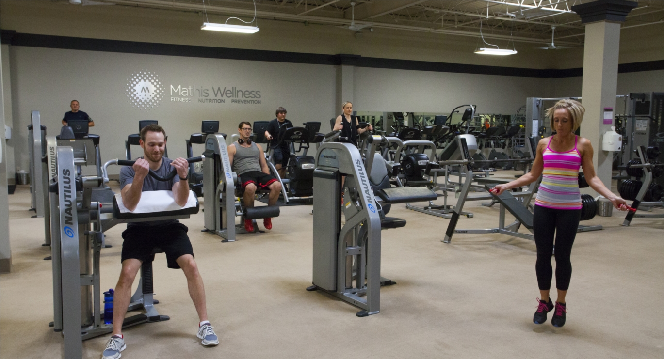 Employees improve their health inside our onsite Mathis Wellness Center with the help of our staffed personal trainers.