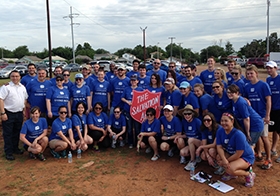 The firm's employees help the Oklahoma City Chapter of the Salvation Army to build a garden