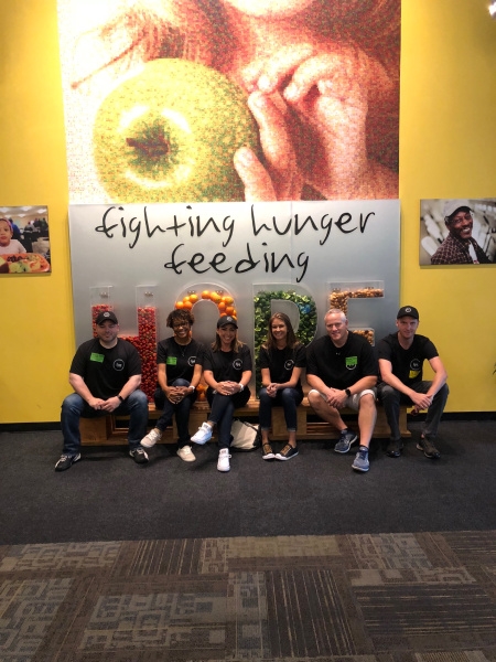 The Learning and Development Team utilized their FPG benefit, "Giving Day", by volunteering their time at the Second Harvest Food Bank in Orlando, FL! They helped pack meals for 9,000 children in the local area.