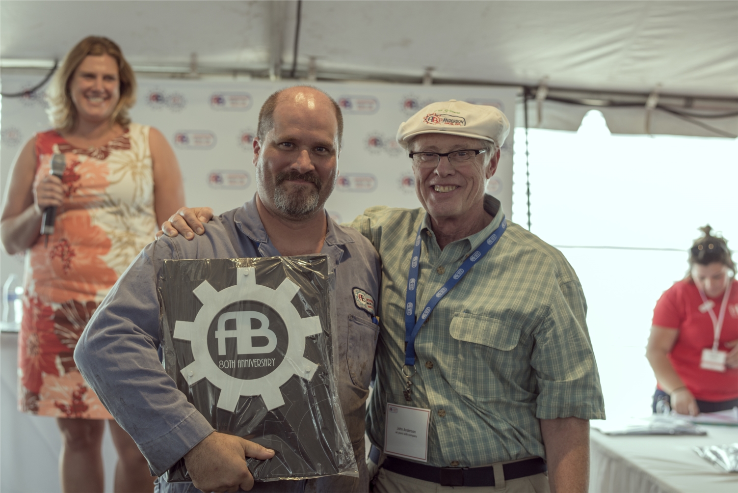 Jason Gee presented with his 13 years of service plaque from John Anderson at our 80th Anniversary celebration in June of 2015. 