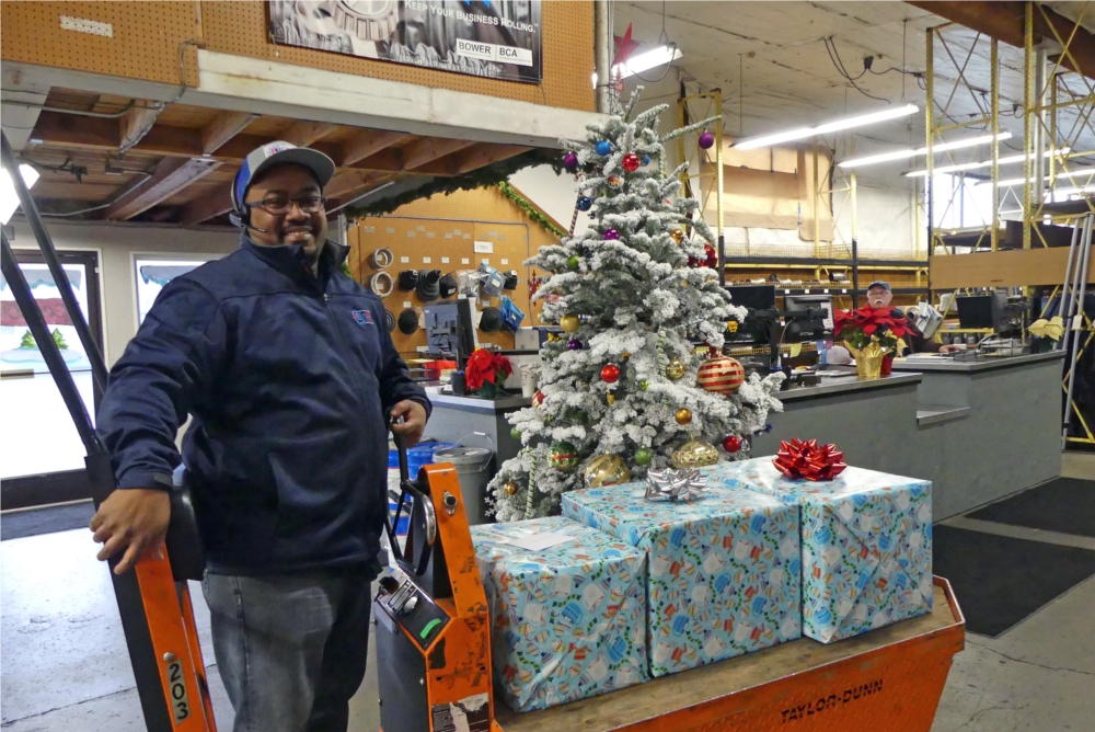 Andre Washington taking our gifts out to load up and then be delivered to our Adopted Family of Dec 2017.