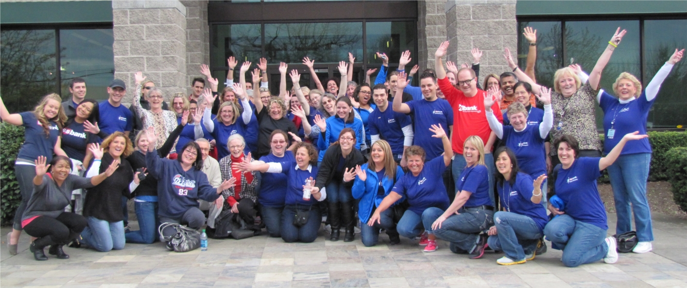 U.S. Bank employees celebrate volunteering at Oregon Food Bank. 