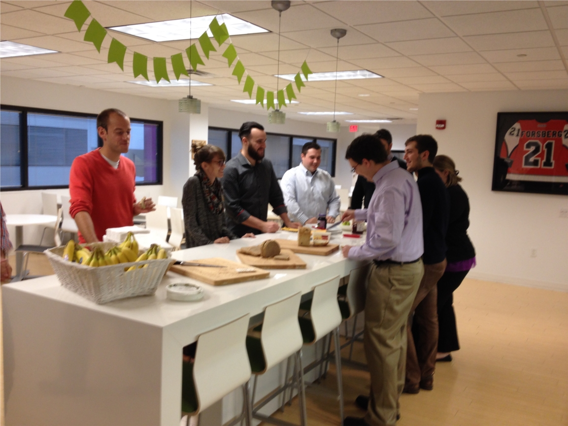 Team members mingling while enjoying the daily "FIKA" break featuring free food and beverages. 