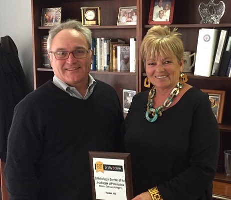 Jim Amato, Secretary of Catholic Human Services, and Amy Stoner, Director of Housing and Homeless and Community Based Services Divisions, celebrating our Top Workplace achievement! 