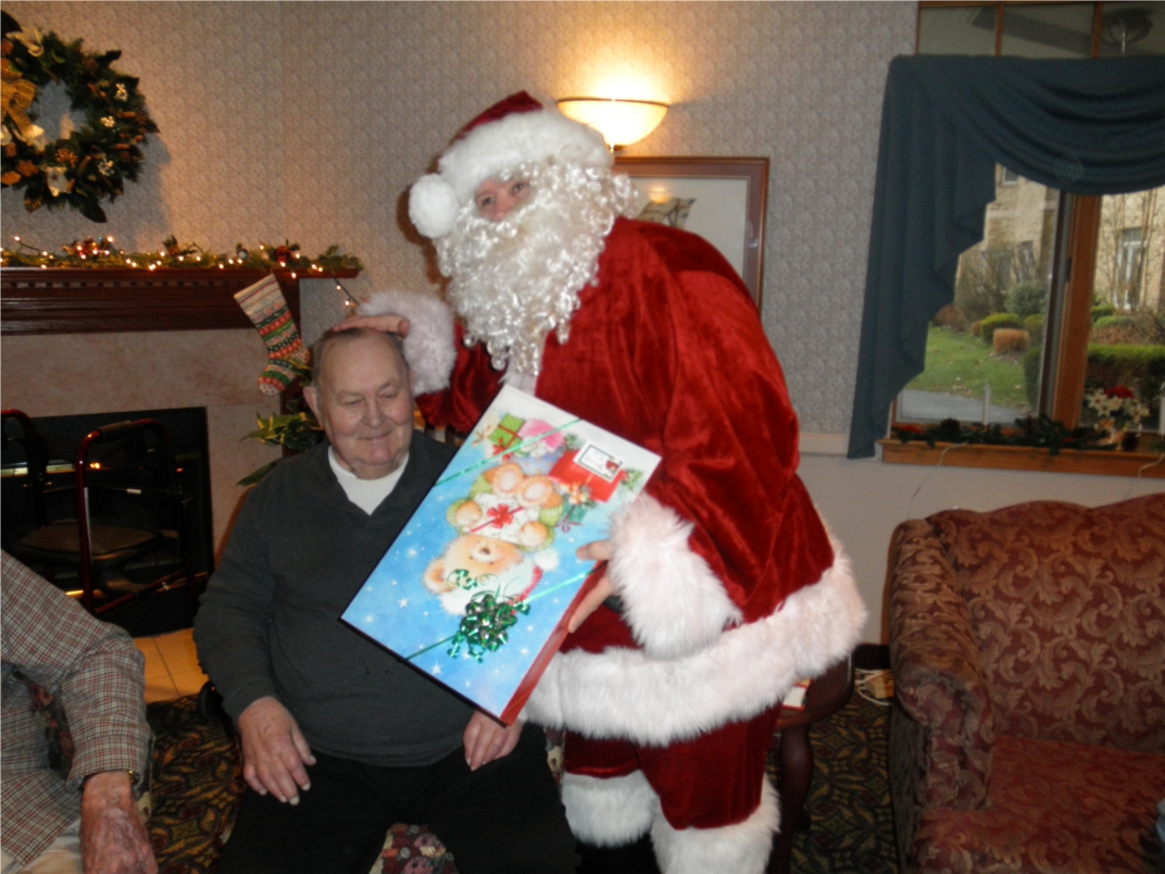 "Santa" delivered Christmas gifts to the residents at Artman. 