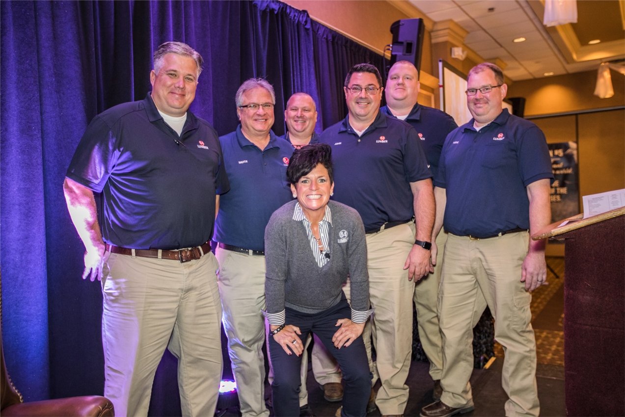 84 Lumber owner and President Maggie Hardy Magerko with various store managers at the company's 2017 Town Meetings.