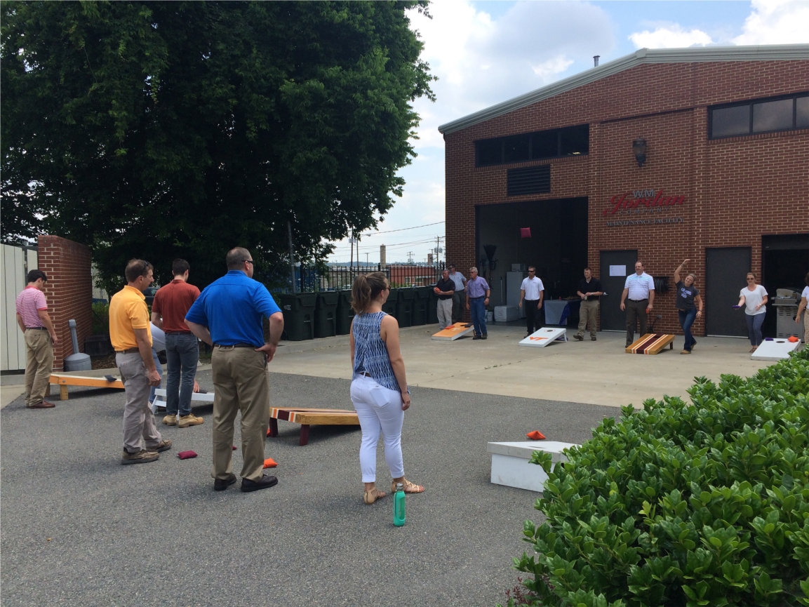 W. M. Jordan Company's Richmond employees enjoy a cornhole tournament at their Manchester campus.