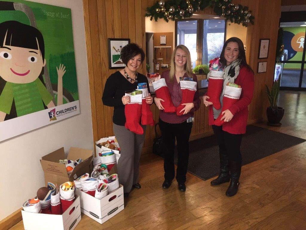 W. M. Jordan Company staff members support the local community with Christmas stockings for kids at Children's Hospital of Richmond.