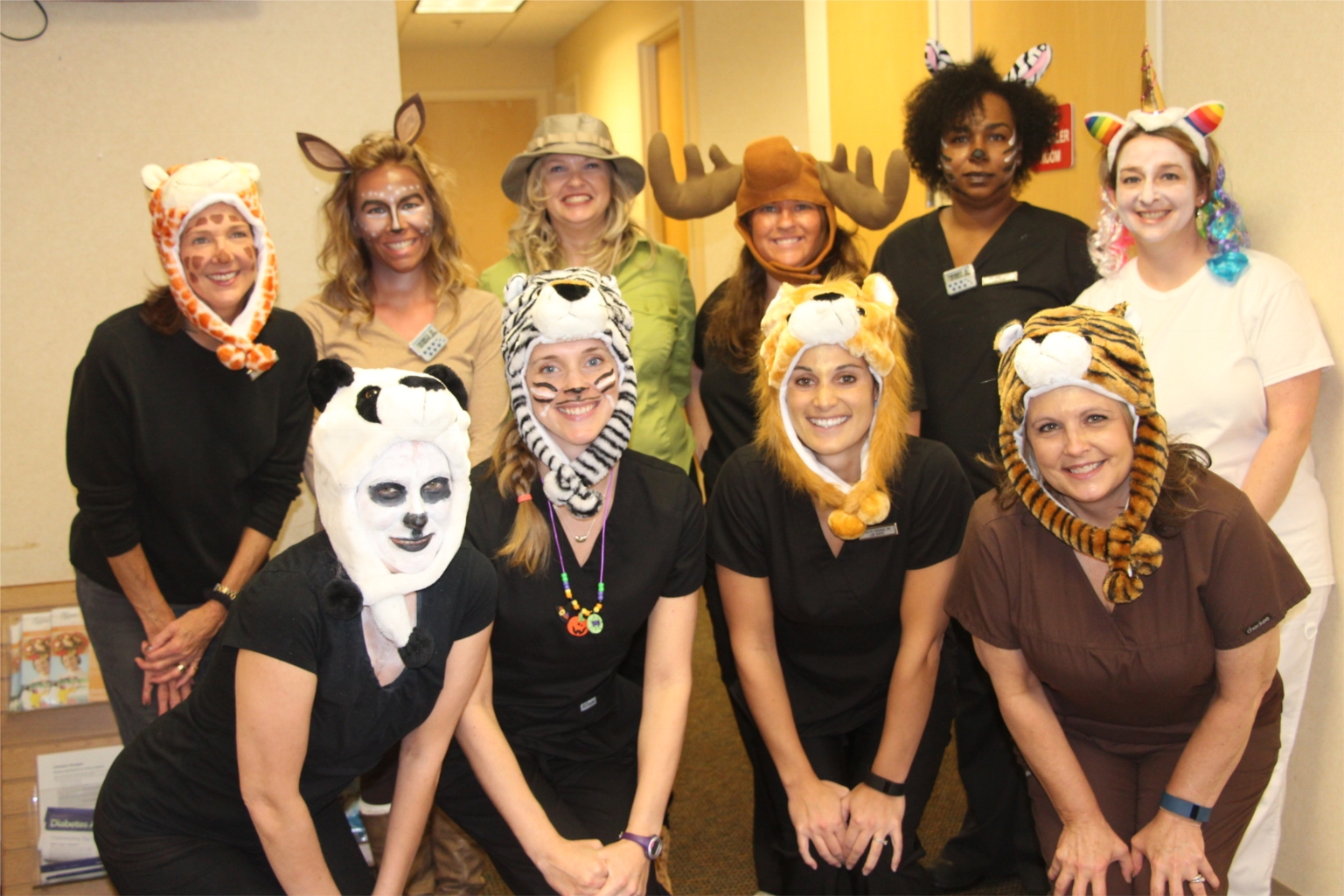 The Lab Supervisor, Amy, dressed as a hunter and Lab Nurses dressed as animals on Halloween.