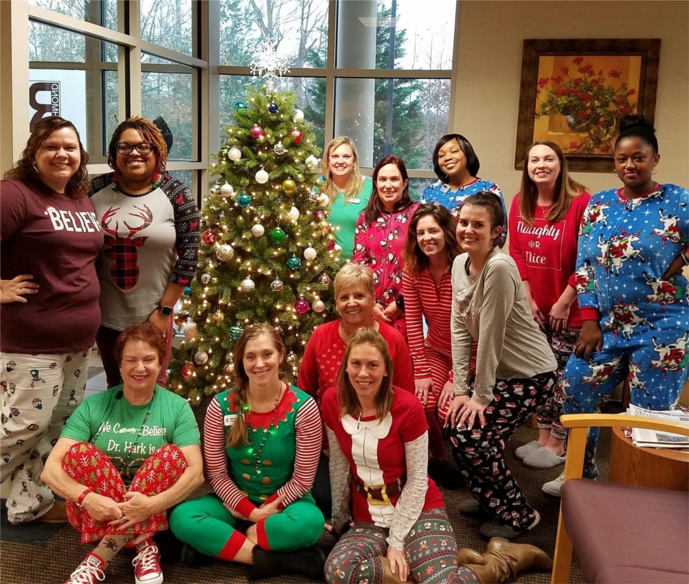 The Office Administrator and Staff dressed in their pajamas on PJ Day during Comfort and Joy Week.