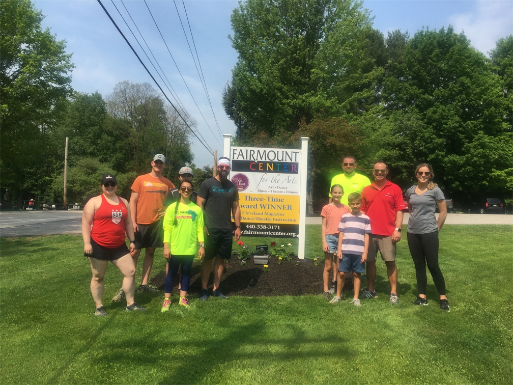 Shook volunteers planting flowers for the Fairmount Center for the Arts