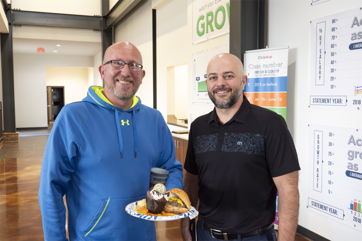 Ben Reckhemmer (left) celebrating his 20th anniversary at Clickstop alongside Founder and CEO, Tim Guenther (right)