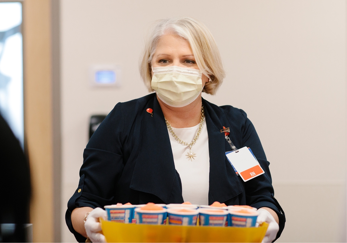 Chief Nursing Officer, Tammy Webb, serves Slurpees during Nurses Week