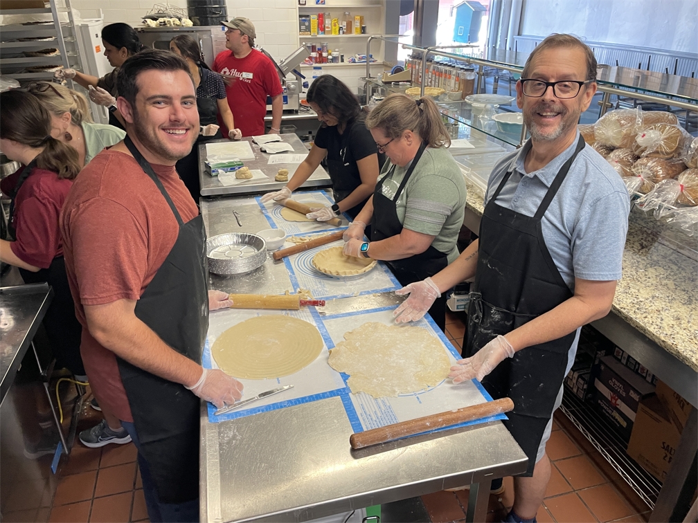 Hugs Cafe trains and employs adults with disabilities. Capital One associates helped bake pies that will be sold during the holidays.