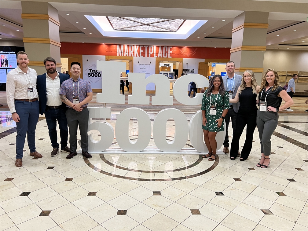 Blue Signal Team posing in front of the Inc. 5000 sign at the Inc. 5000 Gala in Phoenix.jpeg