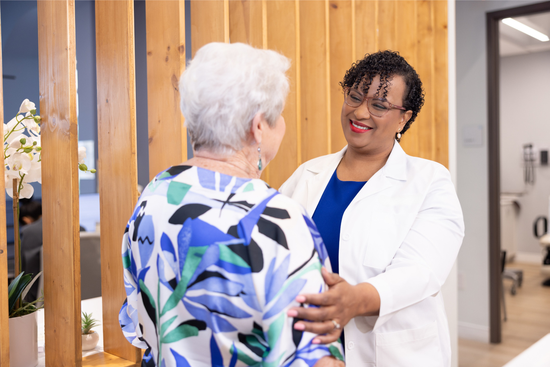 Dr Gianni Neil with Patient.png
