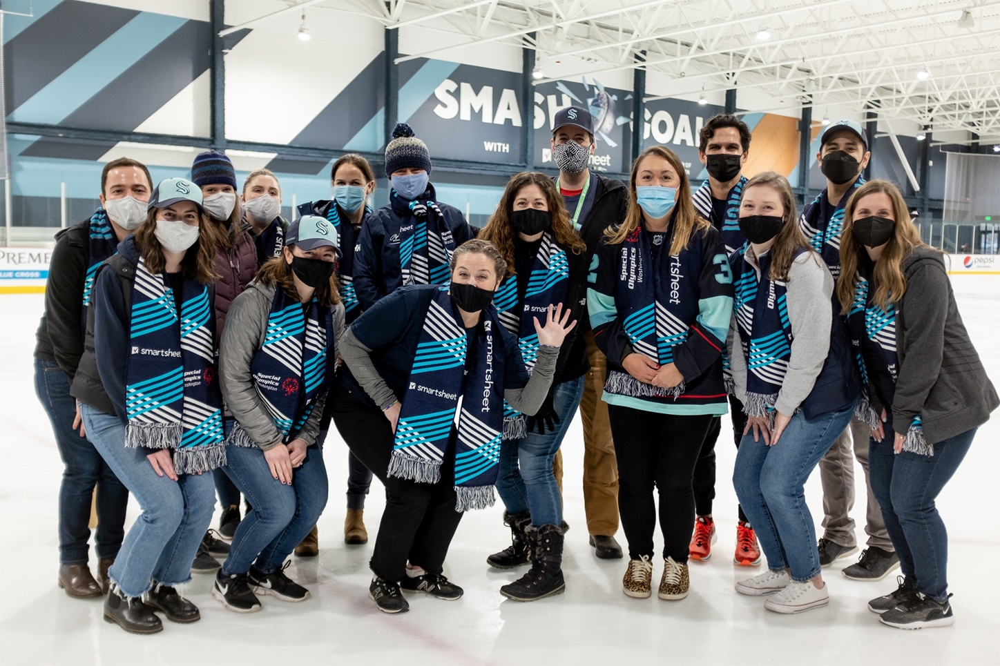 Smartsheet employees volunteering at an event for Special Olympics athletes at the Kraken Community Iceplex.