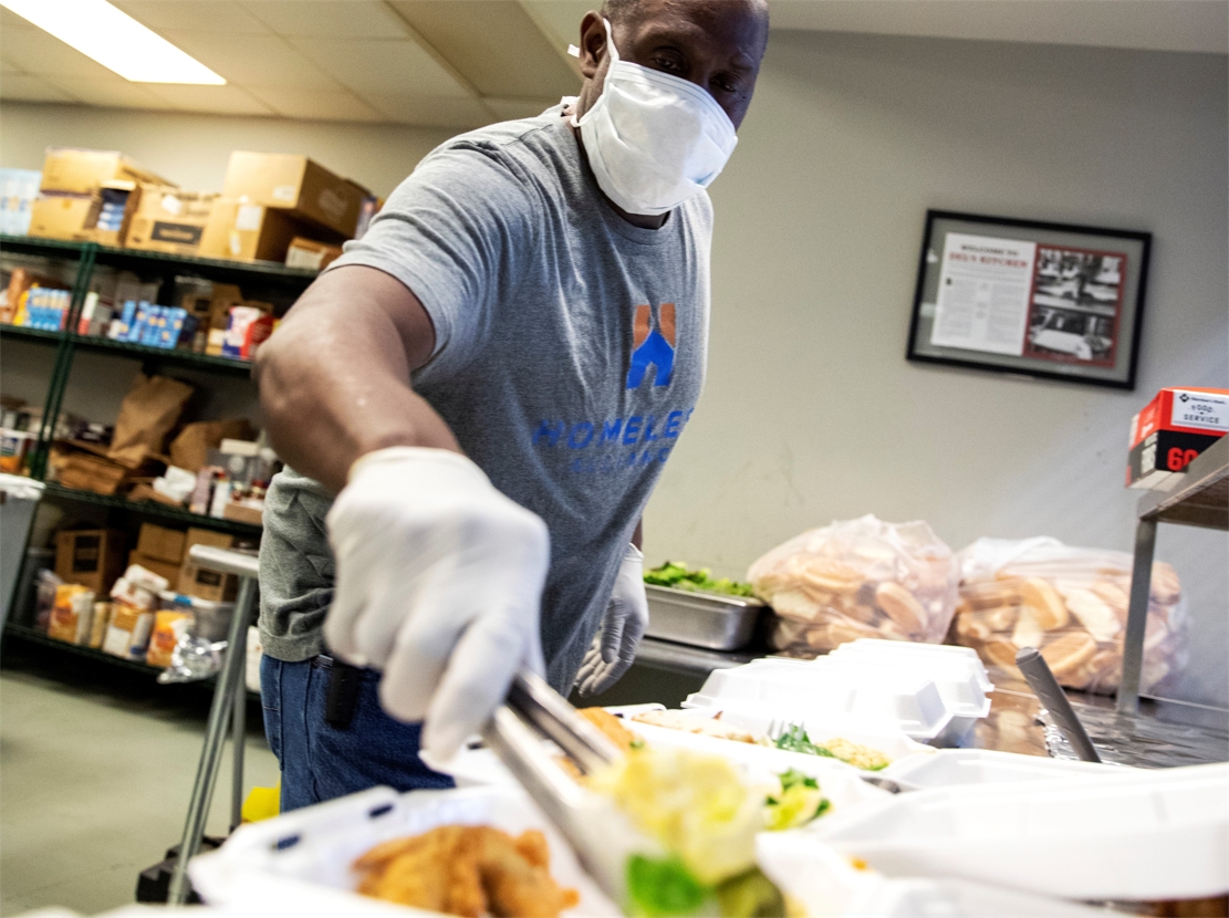 Food being plated in day shelter.jpg