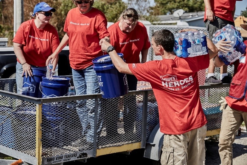 Lowe's associates helping in the bucket brigade.