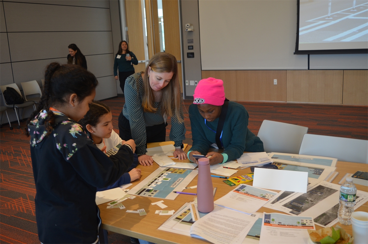 2023 Introduce a Girl to Engineering Day - Paige with 3 Girls.JPG