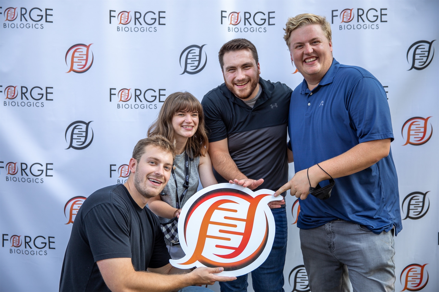 Forge team members celebrating at a Family & Friends event