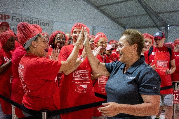 AARP CEO Jo Ann Jenkins and staff members volunteer at AARP Foundation’s annual Celebration of Service Meal Pack Challenge on the National Mall