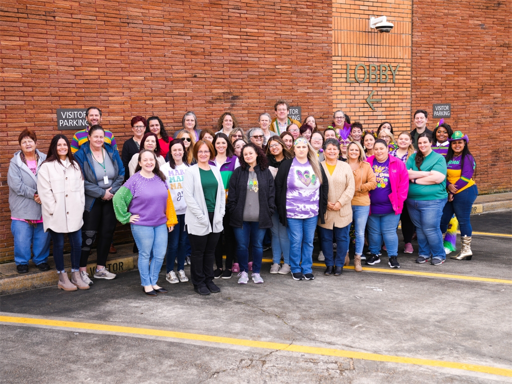 Our Annual Corporate photo, this year it was a Mardi Gras theme!
