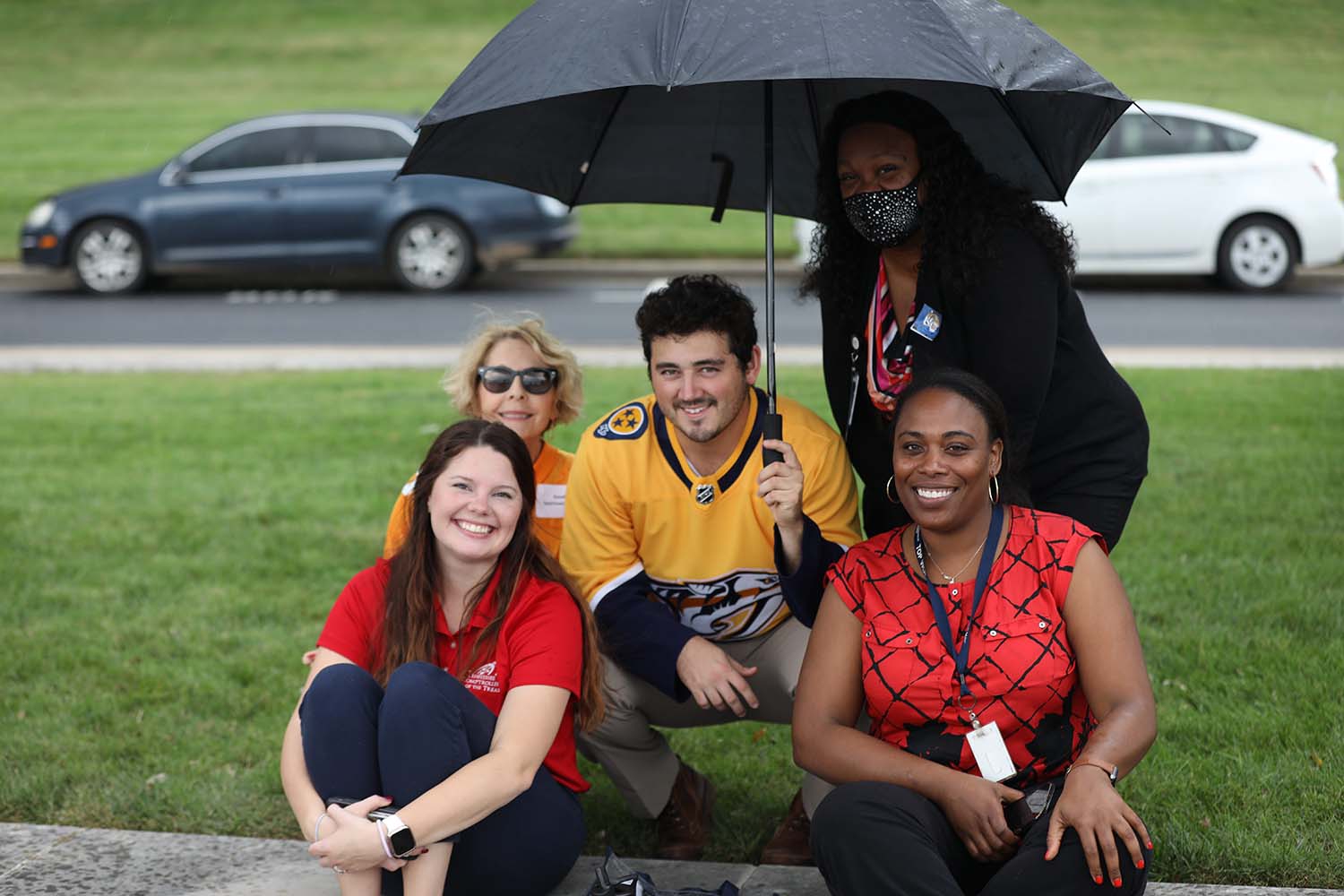 A few drops of rain will not stop these employees from the Comptroller’s Office of State Assessed Properties from enjoying the employee Tailgate at the Comptroller’s main office in Nashville, Tennessee.