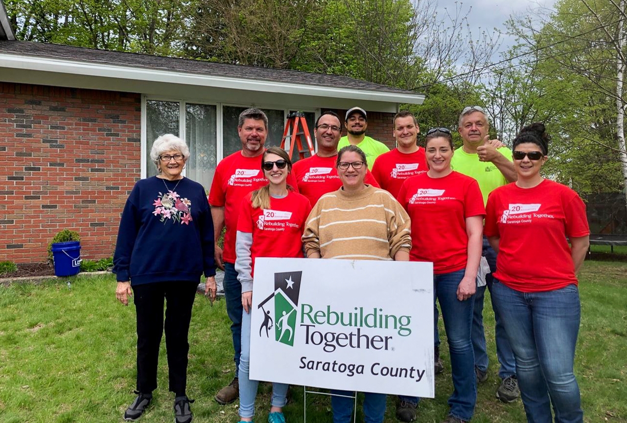 Our employees volunteering with Rebuilding Together Saratoga County to help with repairs to an older couple's home
