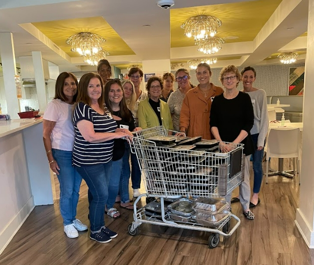 Kravet family members working with employees to cook dinner for families staying at the Ronald McDonald House.