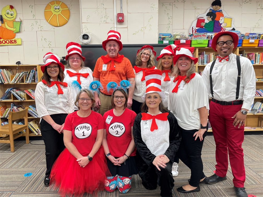 Pinnacle associates love serving the community through hands-on volunteering like reading to students for Read Across America.