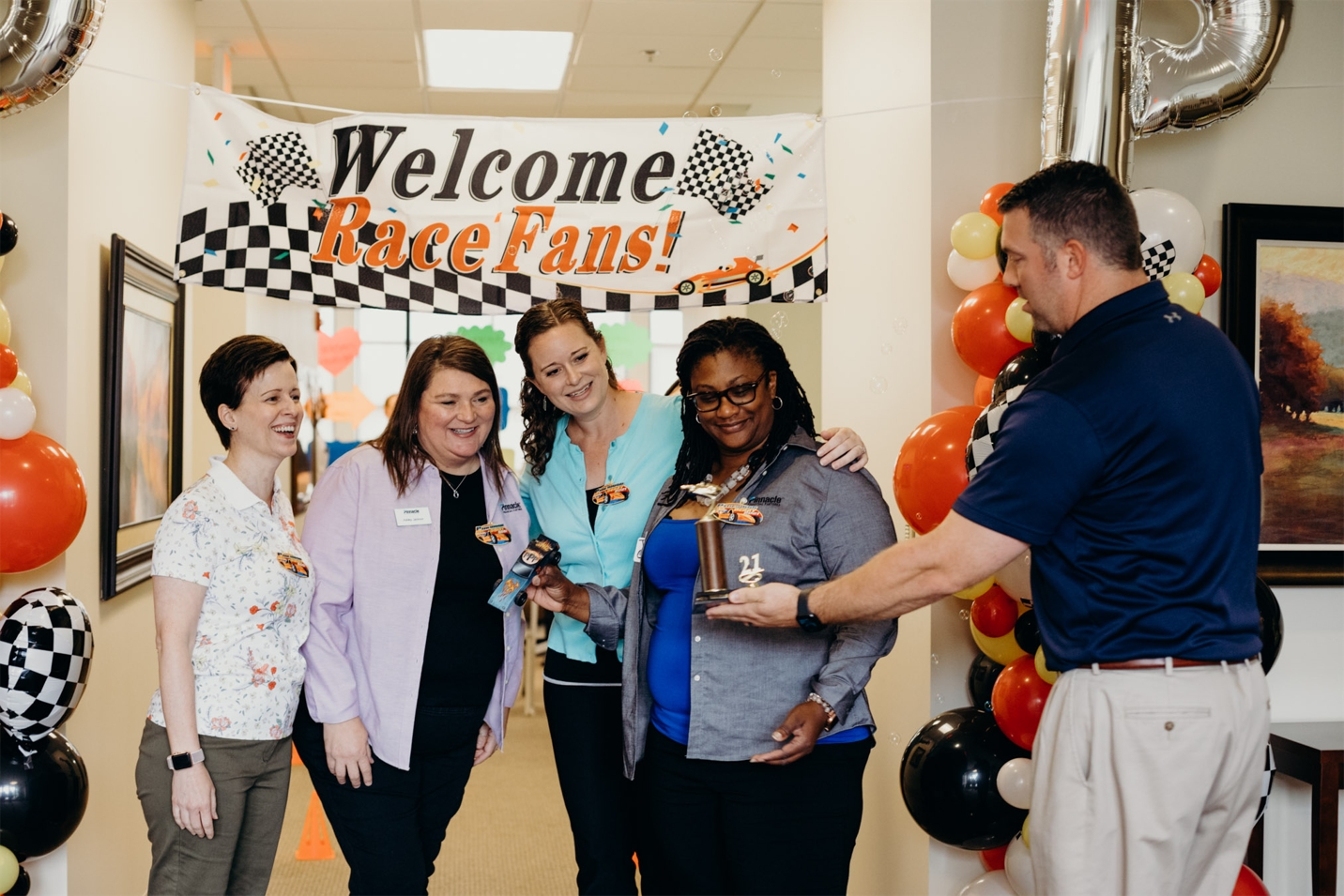 Part of the special sauce in Pinnacle's culture is the intentional effort to build teamwork, like with this SBA team that won the Pinnacle Pinewood Derby for having the best car design in SC Upstate.