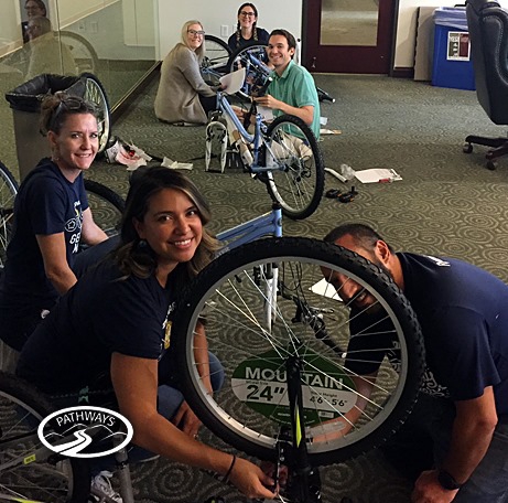 Team Members in Austin work together to build bikes for a good cause.