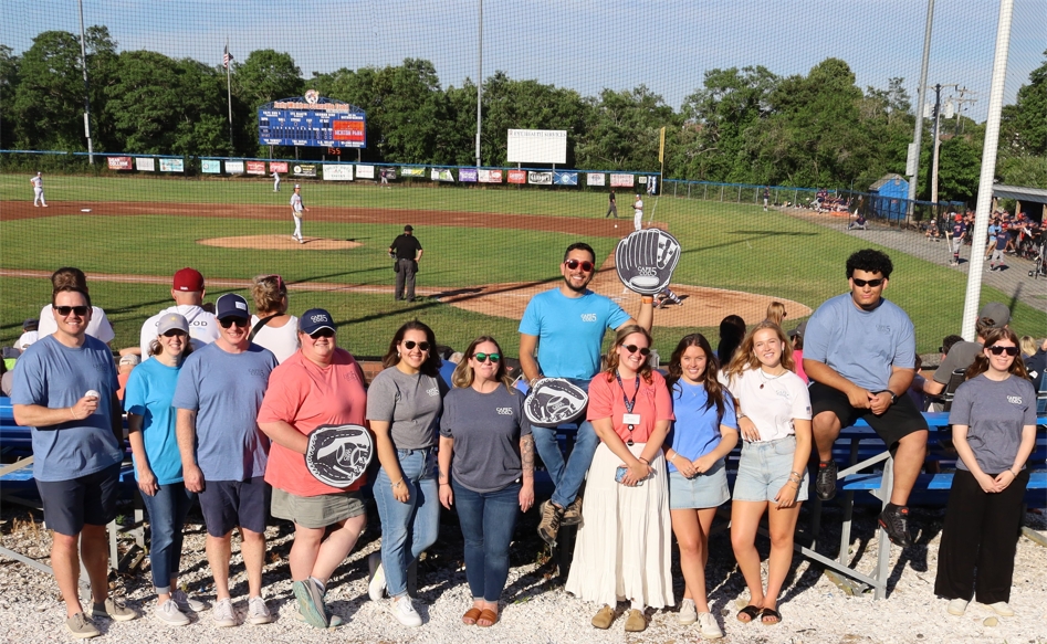 Colleagues representing Cape Cod 5 at the Cape Cod Baseball League Harbor Hawks game.