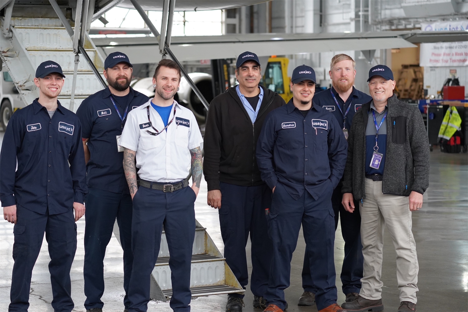Some of our amazing mechanics pictured at the historic Packard Hangar at Willow Run Airport