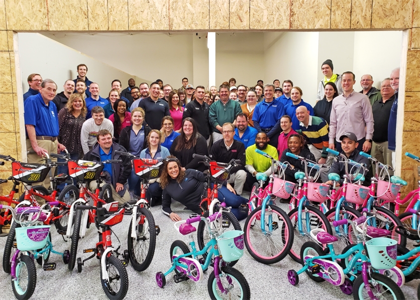 Over 60 RWC employees partnered with Together We Rise to build 20 bikes for local foster children.