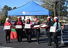 For 2020, the PAGE Social Committee pivoted from its traditional holiday celebration and opted to throw an outdoor drive-through party.