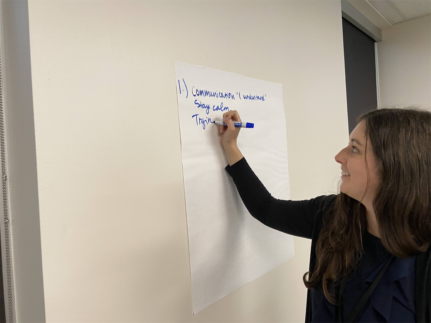 Madeline working on a Leadership class assignment with her group.