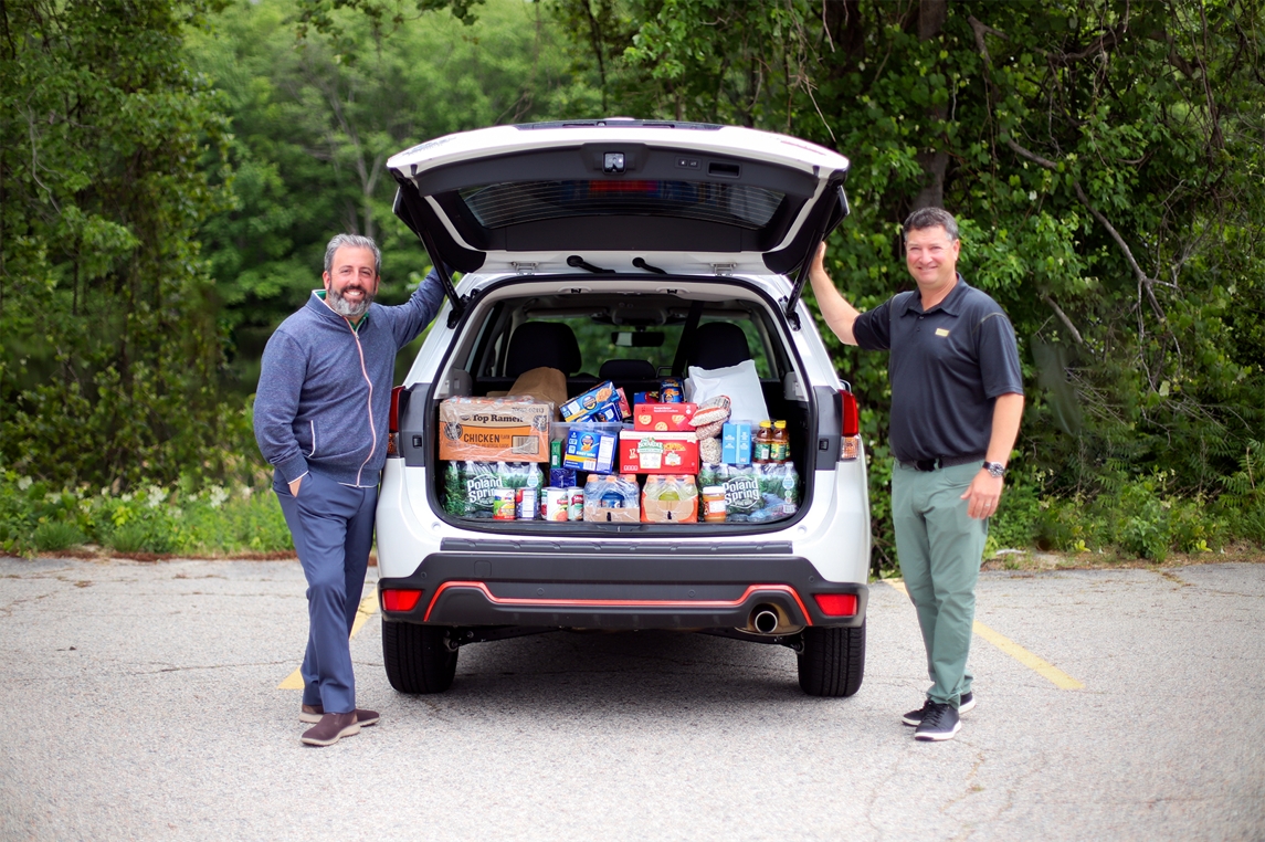 Jason & David Patrick helping the staff deliver non-perishable food items to Auburn Youth & Family Services.