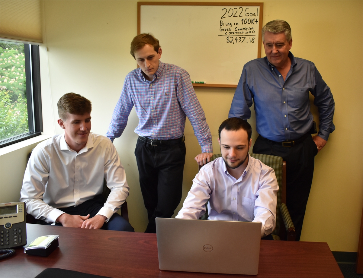 Managing Broker, Jonathan Guion training our interns, with help  from Trey Ayers