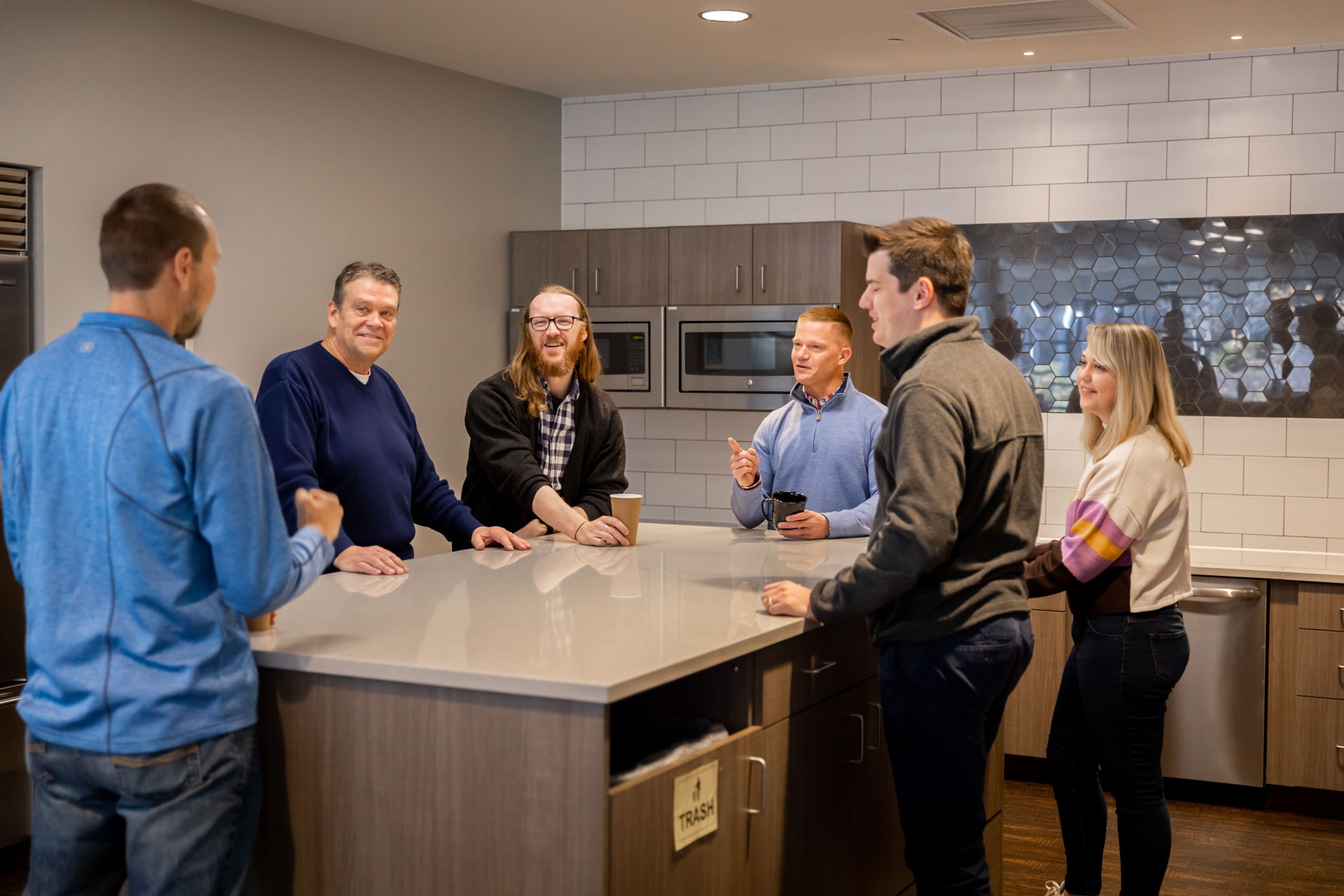 The Singlewire team conversing in the office bistro