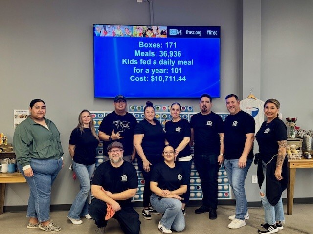 Evergreen's Servicing Department volunteering with their community food bank.