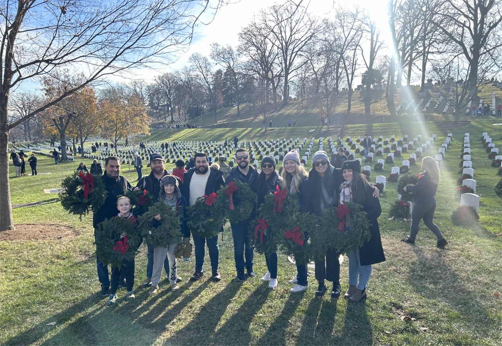 System High colleagues gather together at Arlington National Cemetary for Wreaths Across America.
